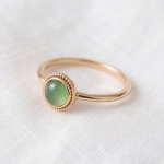 Round Green Chalcedony Bezel Ring with Milgrain Detail in Gold Tone