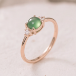 Round Jade Cabochon Ring with Cubic Zirconia Clusters in Rose Gold Tone