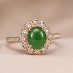 Oval Jade Cluster Ring with Scalloped Halo and Pave Band in Gold Tone