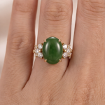 Oval Jade Ring with Cubic Zirconia Flower Clusters in Yellow Gold Tone - Image 2