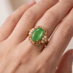 Oval Jade Cabochon Ring with Scrolled Gold Frame and Cubic Zirconia Clusters - Image 8