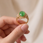 Oval Jade Cabochon Ring with Scrolled Gold Frame and Cubic Zirconia Clusters - Image 5