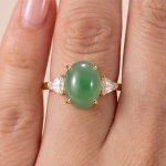 Oval Green Jade Three-Stone Ring with Trillion Cubic Zirconia in Gold Tone - Image 2