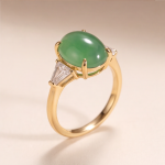 Oval Green Jade Three-Stone Ring with Trillion Cubic Zirconia in Gold Tone