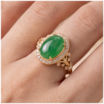 Oval Green Jade Halo Ring with Scrollwork Shoulders in Gold Tone - Image 2