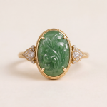 Oval Carved Green Jade Ring with Trillion Cubic Zirconia Shoulders in Gold Tone - Image 10
