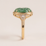 Oval Carved Green Jade Ring with Trillion Cubic Zirconia Shoulders in Gold Tone - Image 4