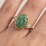 Oval Carved Green Jade Ring with Trillion Cubic Zirconia Shoulders in Gold Tone - Image 5