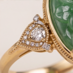 Oval Carved Green Jade Ring with Trillion Cubic Zirconia Shoulders in Gold Tone - Image 9