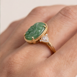 Oval Carved Green Jade Ring with Trillion Cubic Zirconia Shoulders in Gold Tone - Image 8