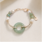 Gold-plated brass, green jade, freshwater pearl, cubic zirconia
