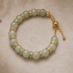 Pale Green Jade Bead Bracelet with Pave Rondelles in Gold Tone
